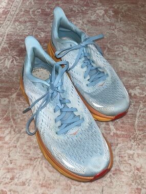 Hoka Women's Pale Blue Running Shoes with Orange-Gold Midsole
